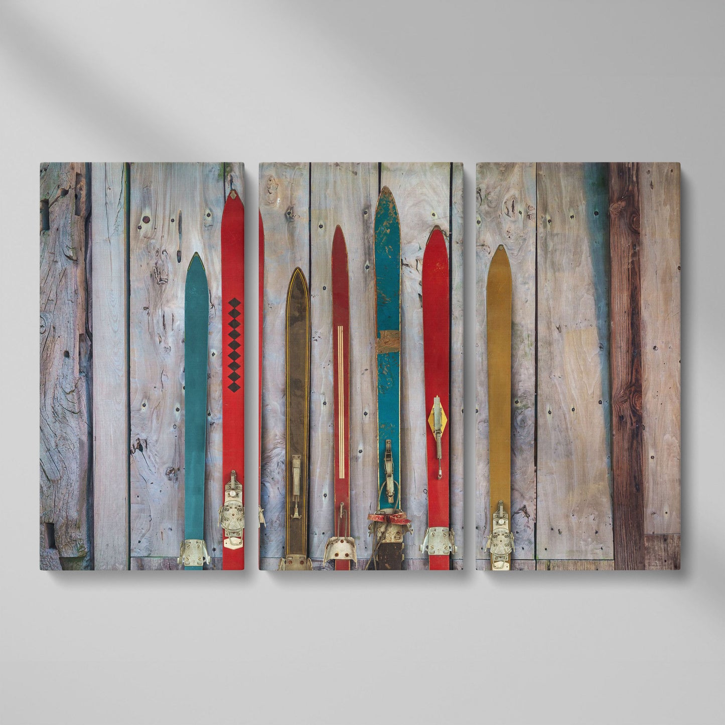 Vintage Wooden Skis on Weathered Planks Canvas Wall Art as 3-panel split version