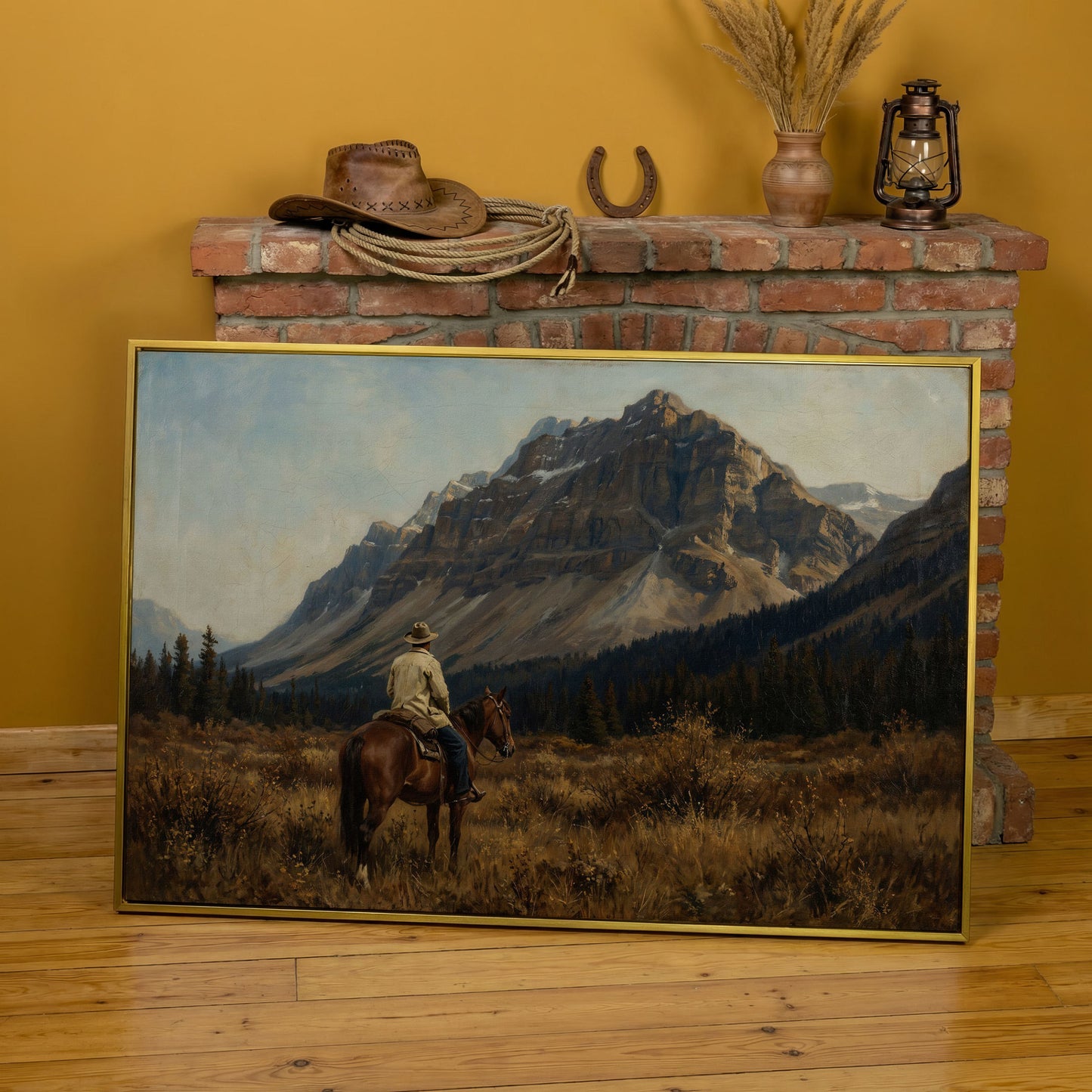 Cowboy on Horseback Facing the Mountains Canvas Wall Art in yellow gold floating frame
