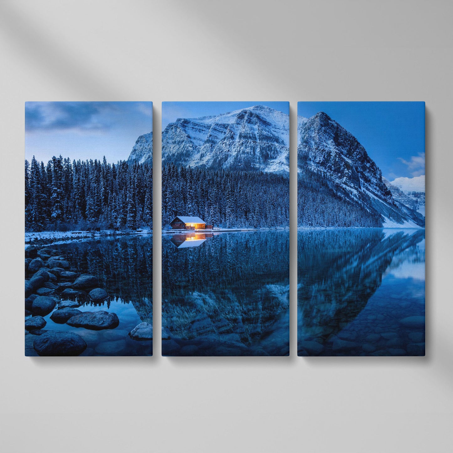 Lake Louise Winter Canvas with Lit Cabin and Mountain Reflection as 3-panel split version