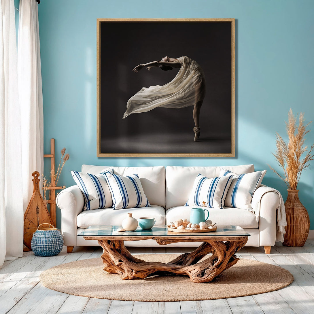 Framed Wall Art: Elegant ballet dancer canvas print in neutral tones. Perfect for adding a touch of art to any space. Coastal-inspired decor with blue accents.