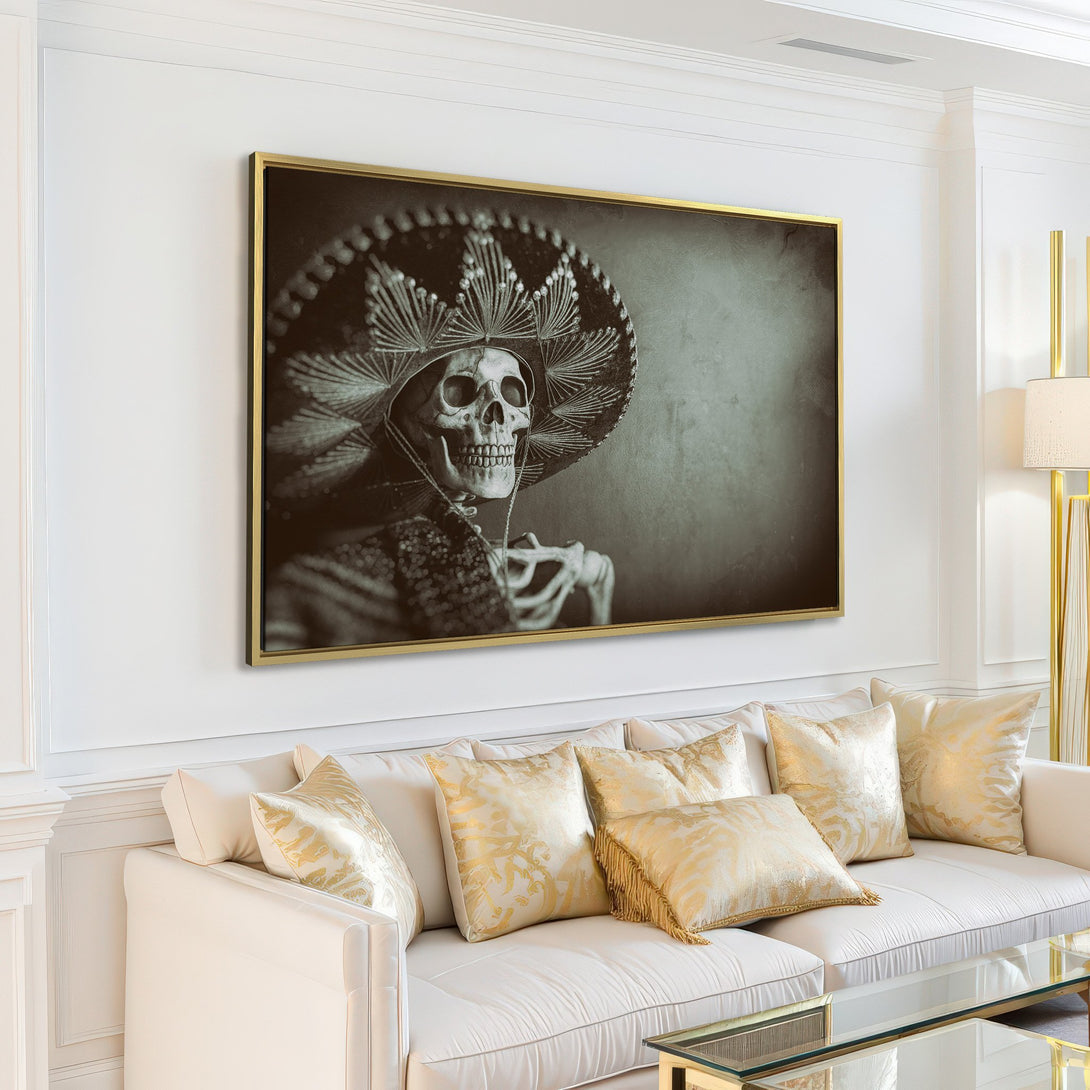 Canvas Print featuring a striking skeleton in a sombrero, displayed in a modern living room. Monochrome art with a vintage, moody aesthetic. Perfect wall decor!