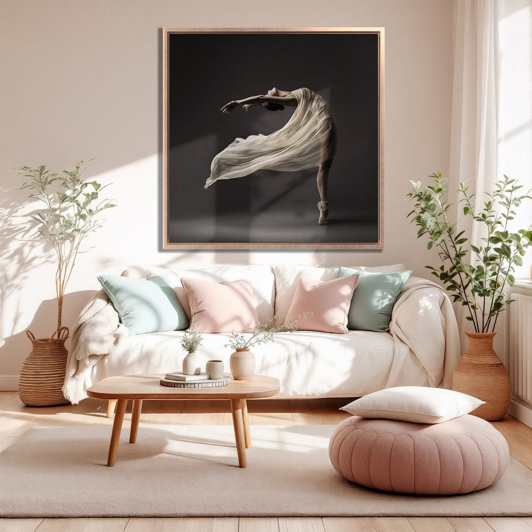 Framed Wall Art of a ballerina in a flowing dress, displayed in a modern living room. Soft, neutral color palette with pops of pink and green.