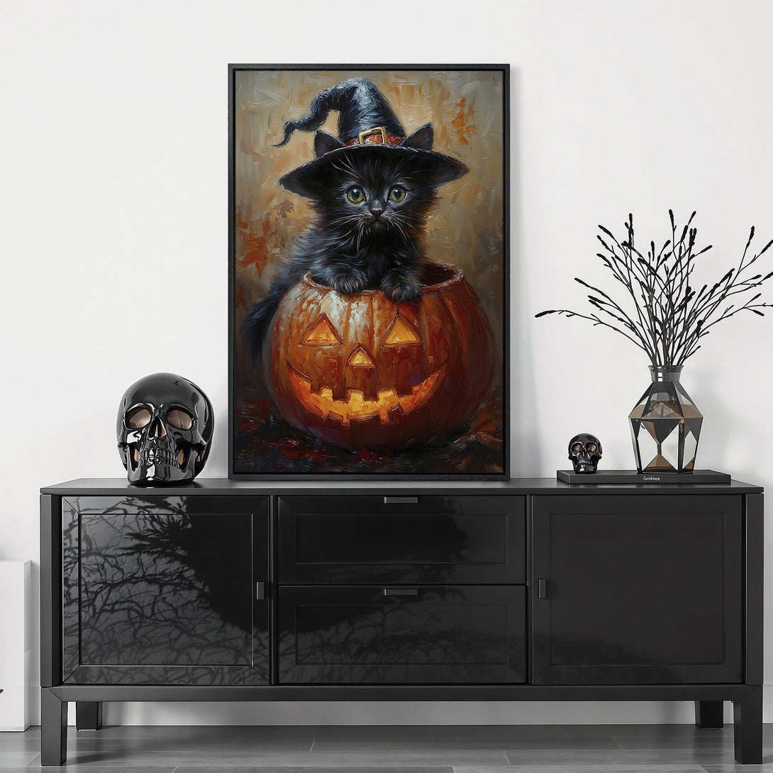 Framed Wall Art: Adorable black cat in a witch hat inside a pumpkin. Halloween-themed artwork with warm orange and black color palette. Perfect for seasonal decor.
