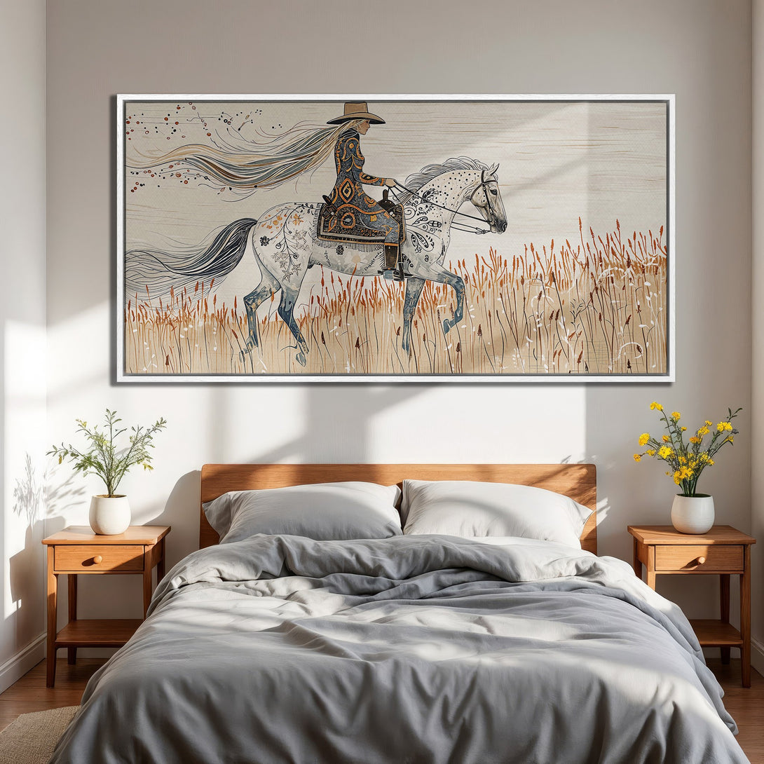 Framed Wall Art: Bohemian-style canvas print of a woman on a horse, neutral color palette with pops of blue and gold, perfect for bedroom decor.