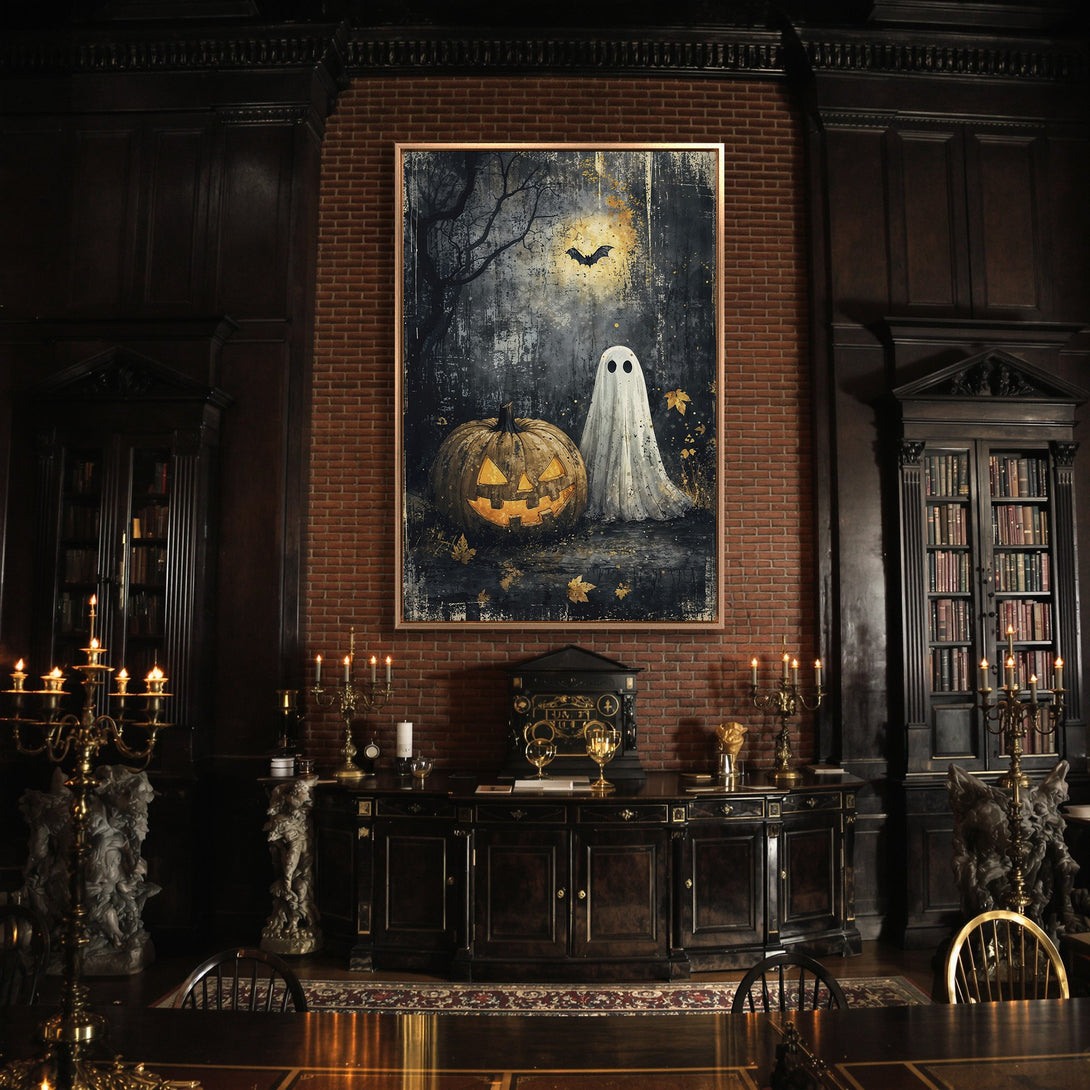 Framed Wall Art featuring a Halloween scene with a pumpkin and ghost. Dark, moody color palette perfect for spooky decor. Add a touch of Halloween to your home!
