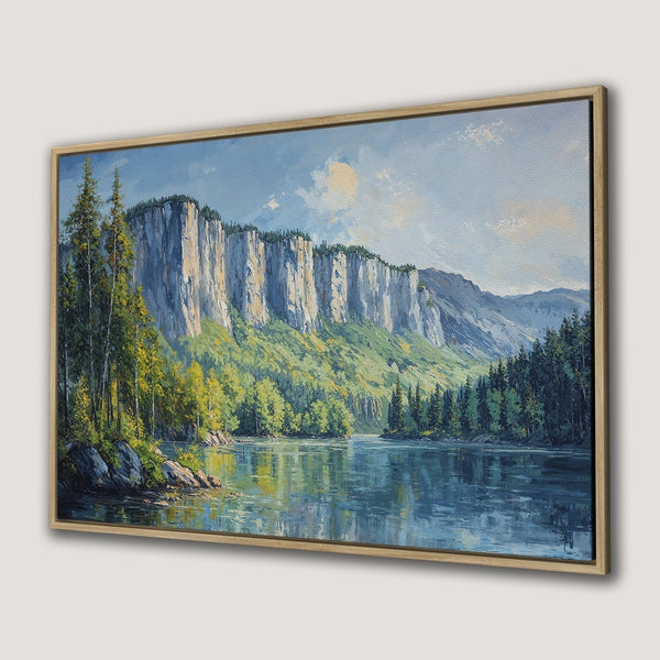 Framed Wall Art: Landscape Canvas Print with serene river scene, featuring mountains, trees, and a blue and green color palette. Perfect for home decor.