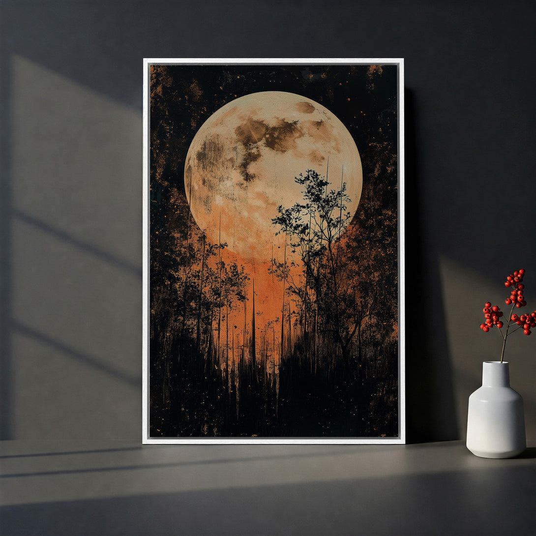 Framed Wall Art featuring a dramatic moonlit forest scene in warm orange and black tones. Perfect for adding a touch of mystery to your home!