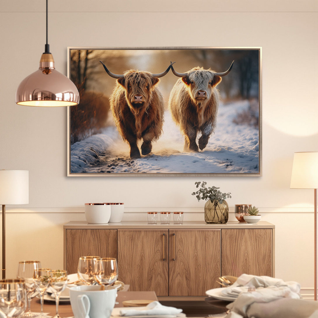 Framed Wall Art featuring Highland cows in a snowy landscape. Warm, inviting color palette. Perfect for rustic home decor.