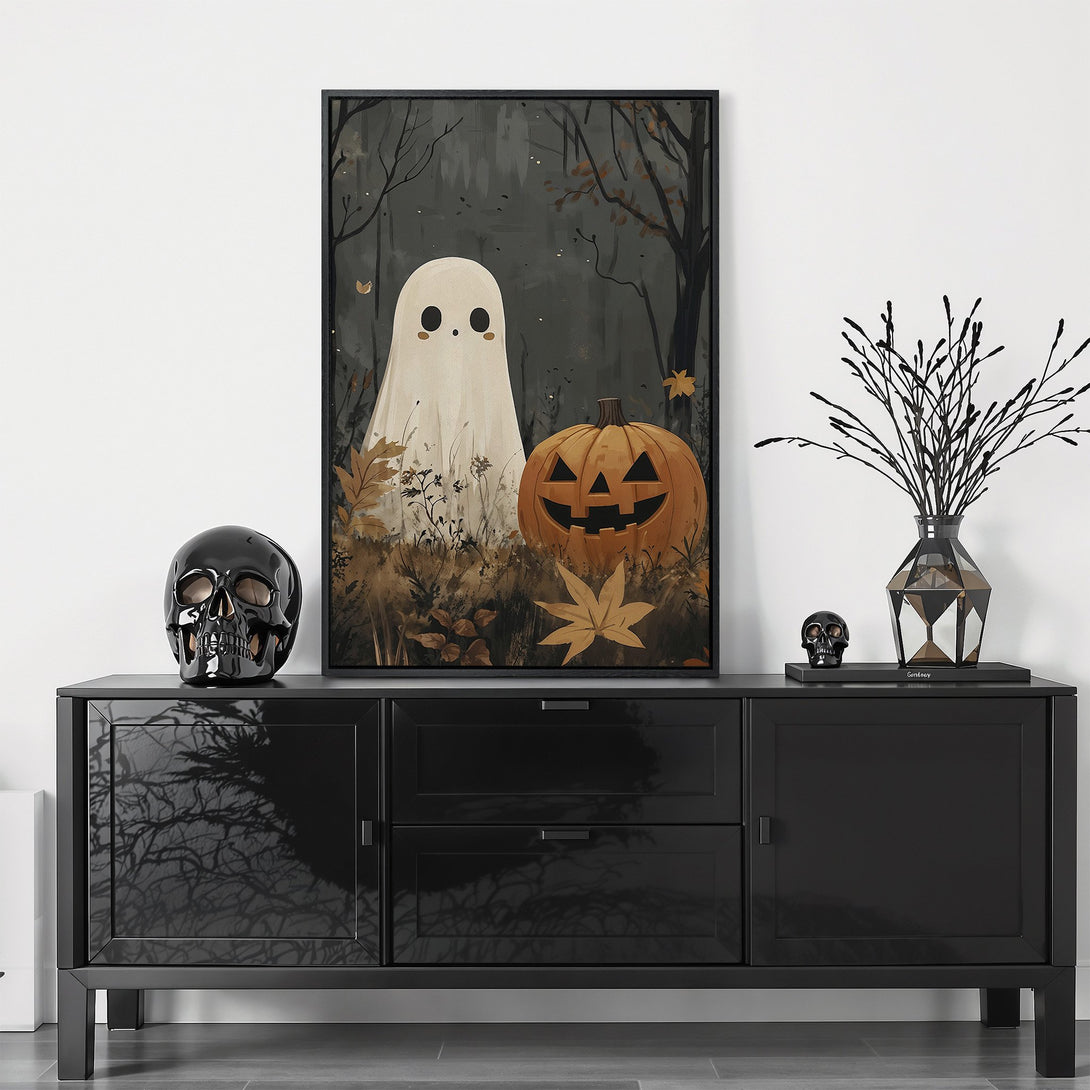 Framed Wall Art: Spooky Halloween scene with a ghost and pumpkin in a dark, moody style. Earthy tones with black frame, perfect for fall decor.