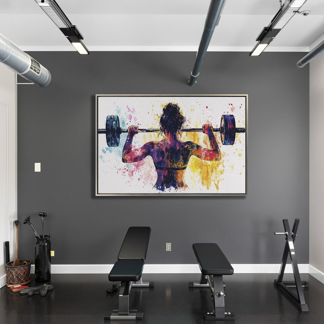 Framed Wall Art: Watercolor woman lifting weights, vibrant color splash art. Perfect gym decor in a modern style.