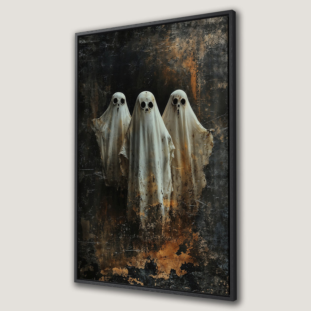 Framed Wall Art featuring three ghostly figures with a dark, textured background. Moody, gothic style with a palette of black, white, and gold. Perfect Halloween decor.