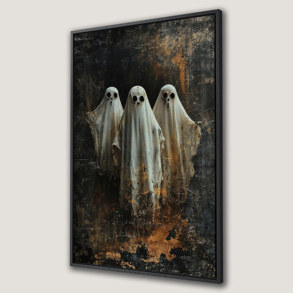 Framed Wall Art featuring three ghostly figures with a dark, textured background. Moody, gothic style with a palette of black, white, and gold. Perfect Halloween decor.