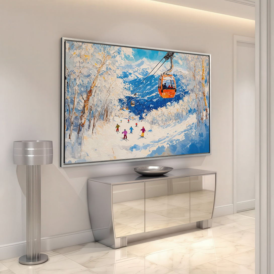 Framed Wall Art featuring a snowy ski scene with vibrant blue, white, and orange hues. Perfect for adding a touch of winter charm to your home decor!