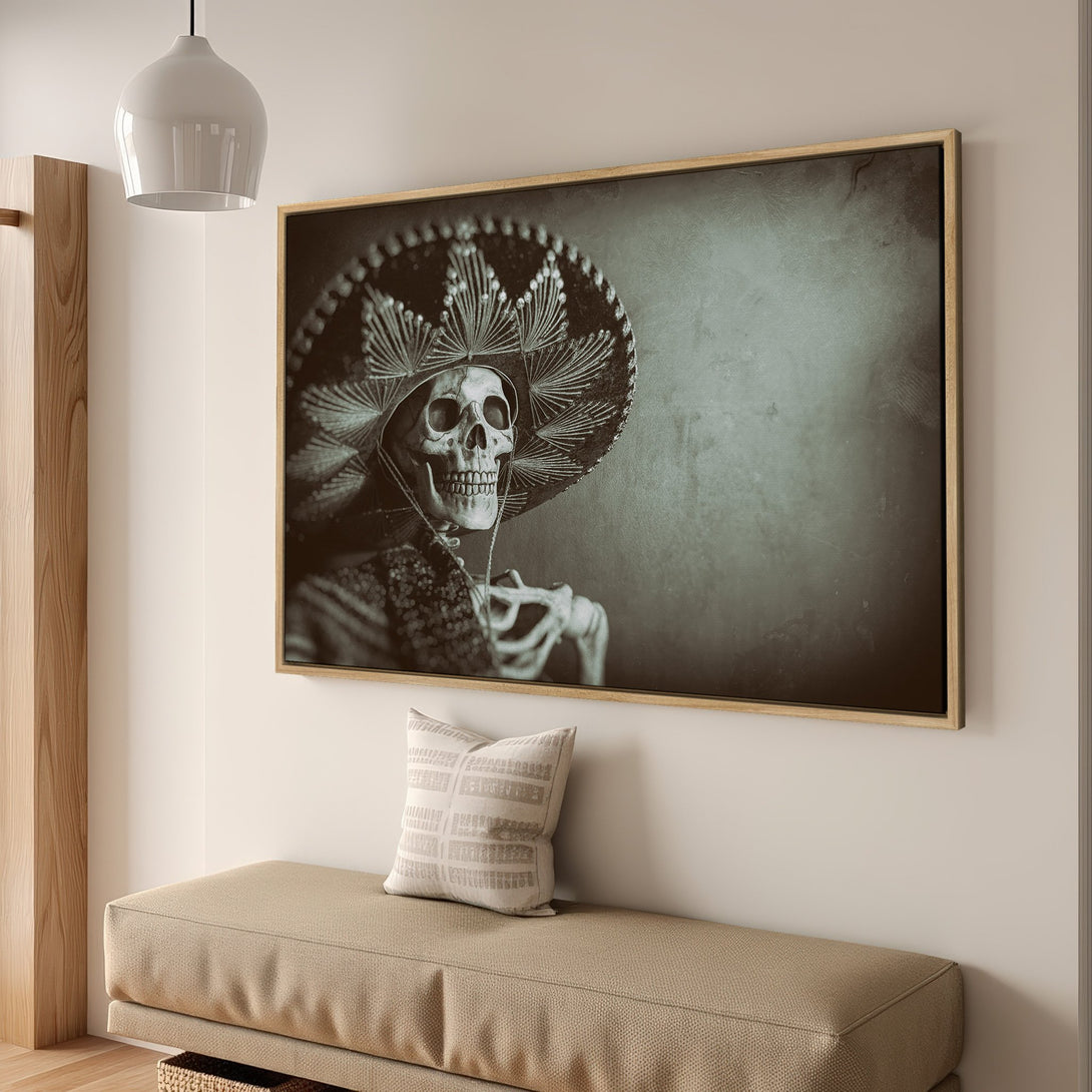Framed Wall Art featuring a skeleton in a sombrero. Vintage style with muted green and sepia tones. Perfect for adding unique flair to any space.
