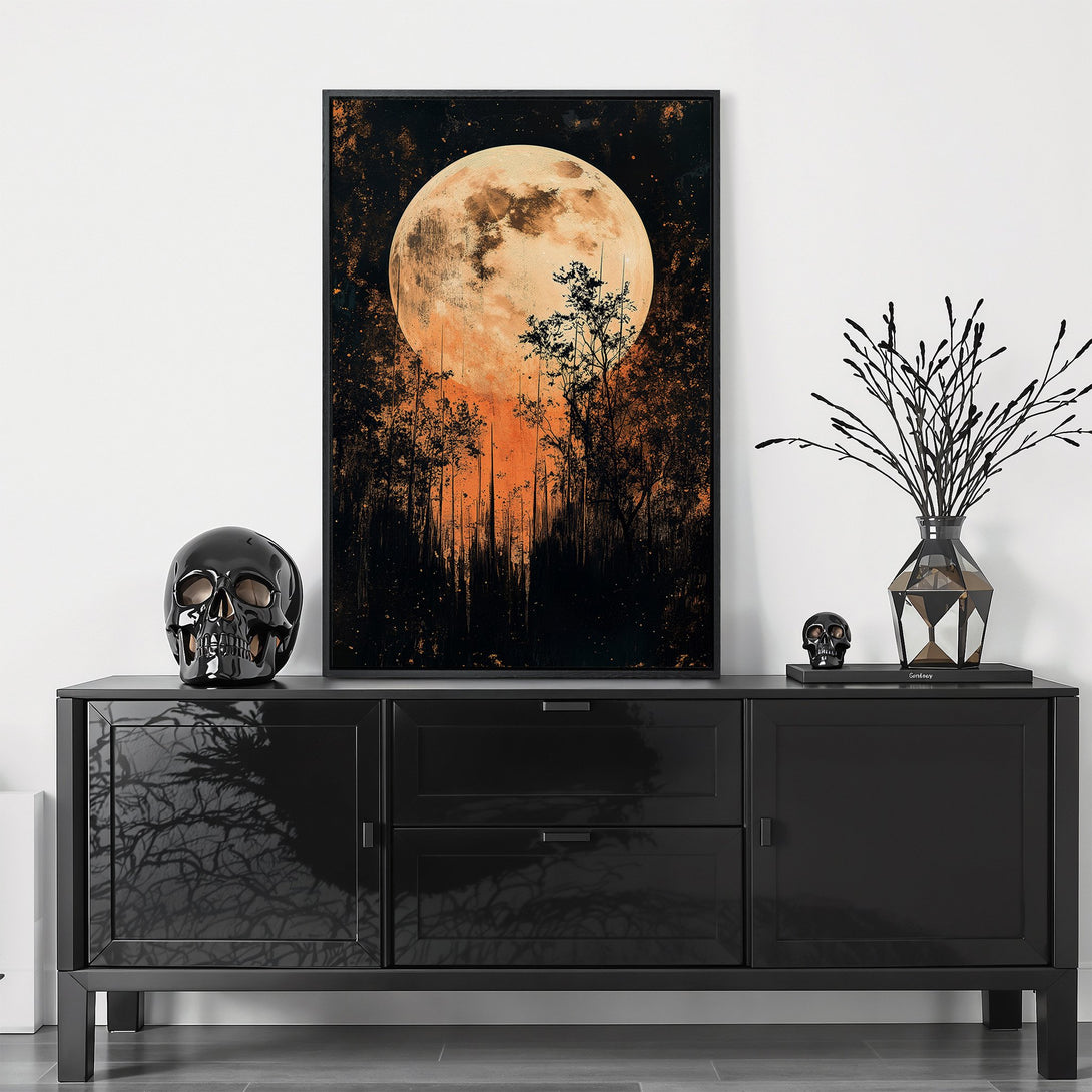 Framed Wall Art featuring a mystical moonlit forest scene in a dark, orange, and black color palette. Perfect for Halloween decor!