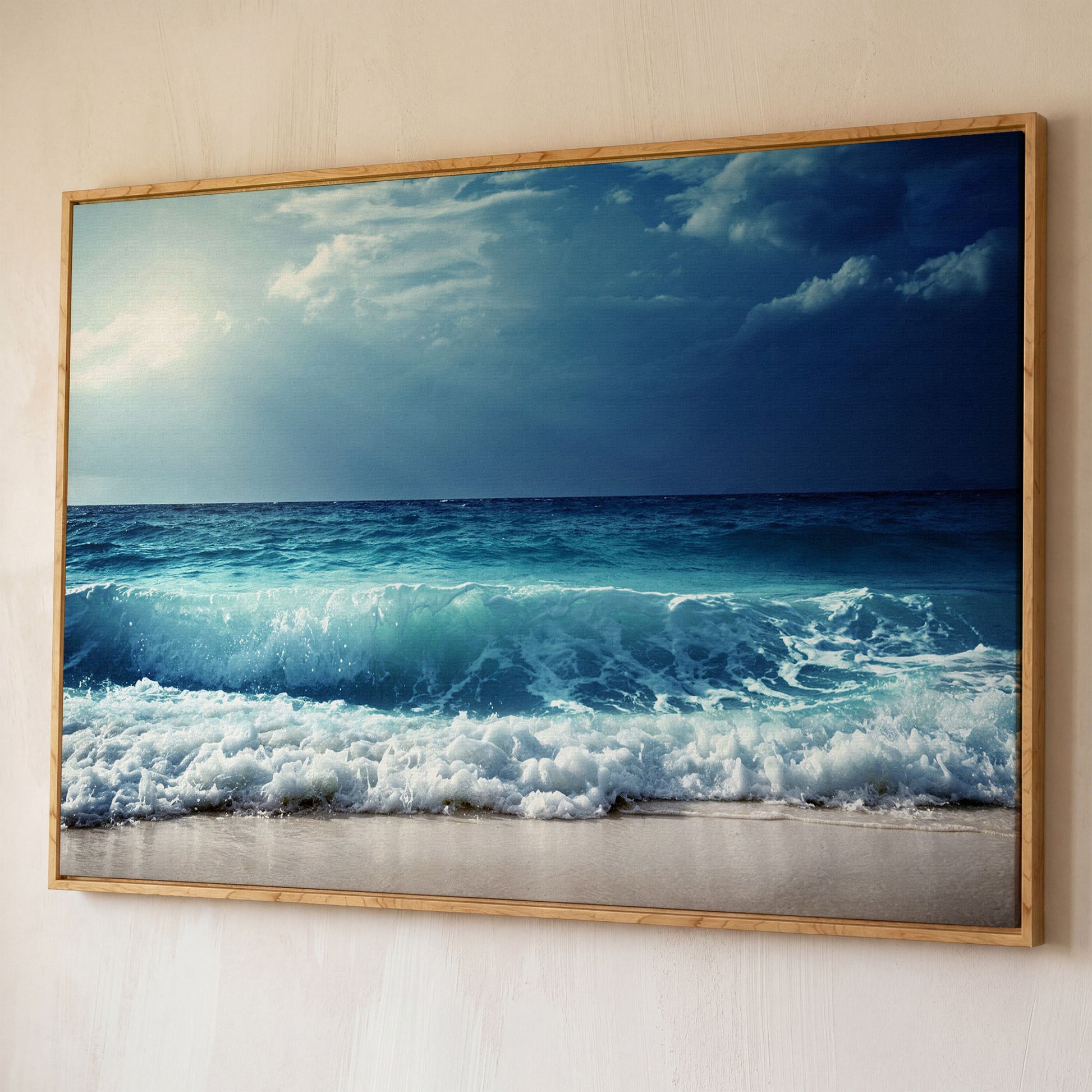 Ocean Wave Breaking on a Sandy Beach, Teal and Grey Canvas Art shown in white oak floating frame