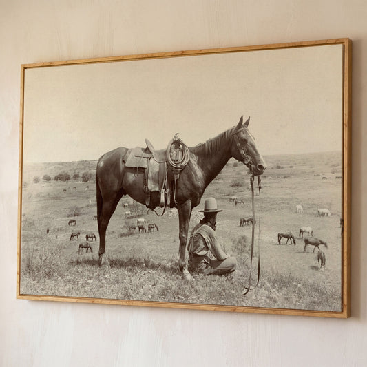 Cowboy Resting by His Horse, Western Field Canvas Wall Art shown in white oak floating frame