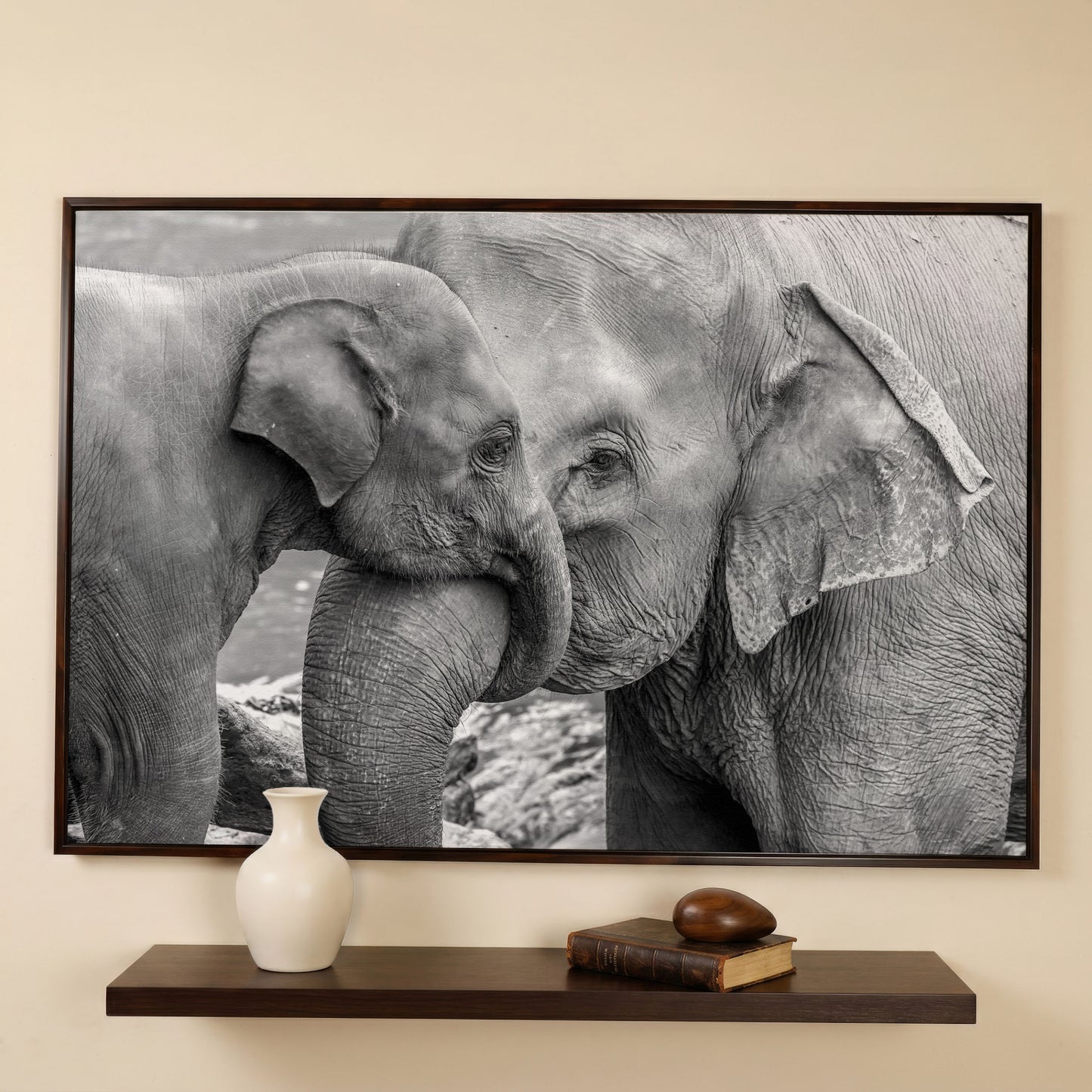 Two Elephants, Trunks Entwined. Canvas Wall Art in dark walnut floating frame