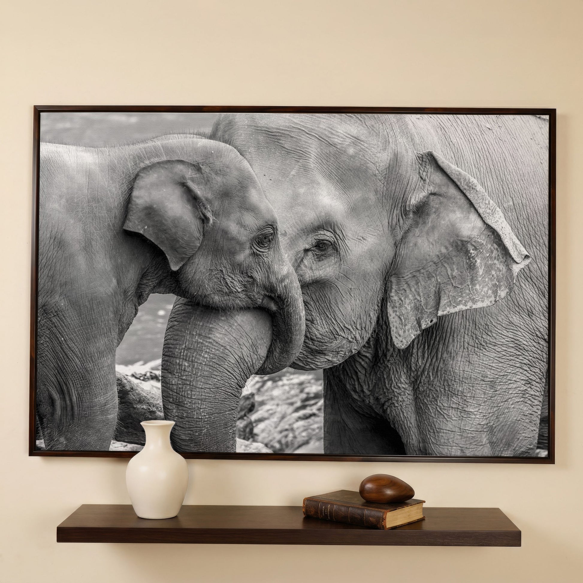Two Elephants, Trunks Entwined. Canvas Wall Art in dark walnut floating frame