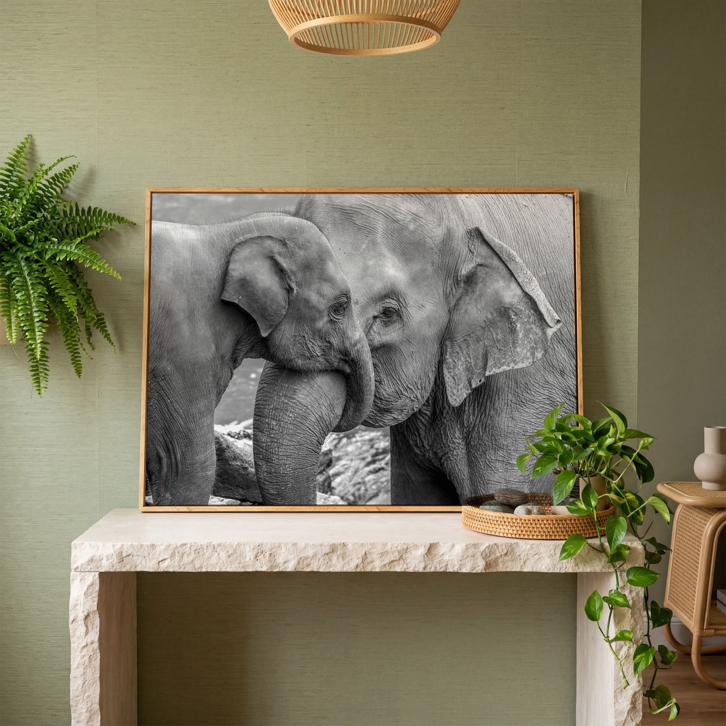 Two Elephants, Trunks Entwined. Canvas Wall Art in white oak floating frame