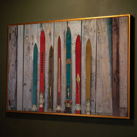 Vintage Wooden Skis on Weathered Planks Canvas Wall Art shown in antique gold floating frame