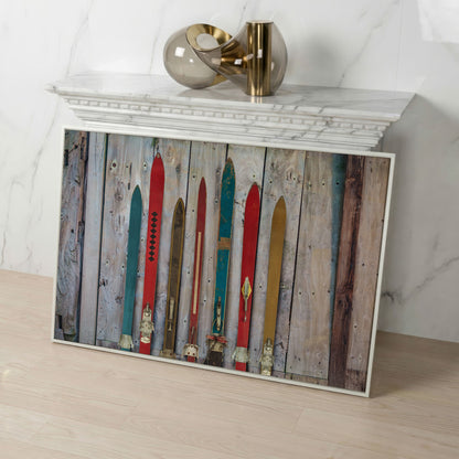 Vintage Wooden Skis on Weathered Planks Canvas Wall Art in white floating frame