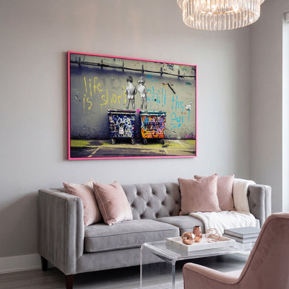 Banksy Boys Peeing Graffiti Canvas Wall Art in pink floating frame