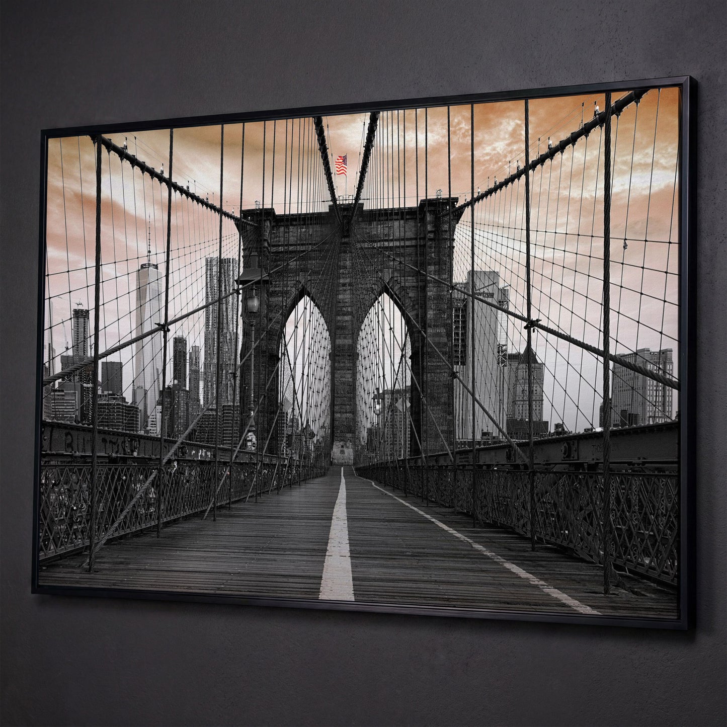 Brooklyn Bridge Canvas Art with NYC Skyline and American Flag shown in black floating frame