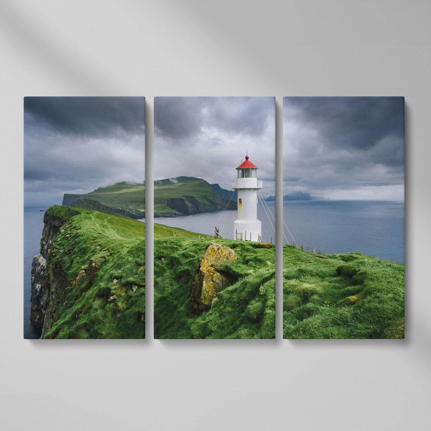 White Lighthouse on a Stormy Cliff, Coastal Canvas Wall Art as 3-panel split version