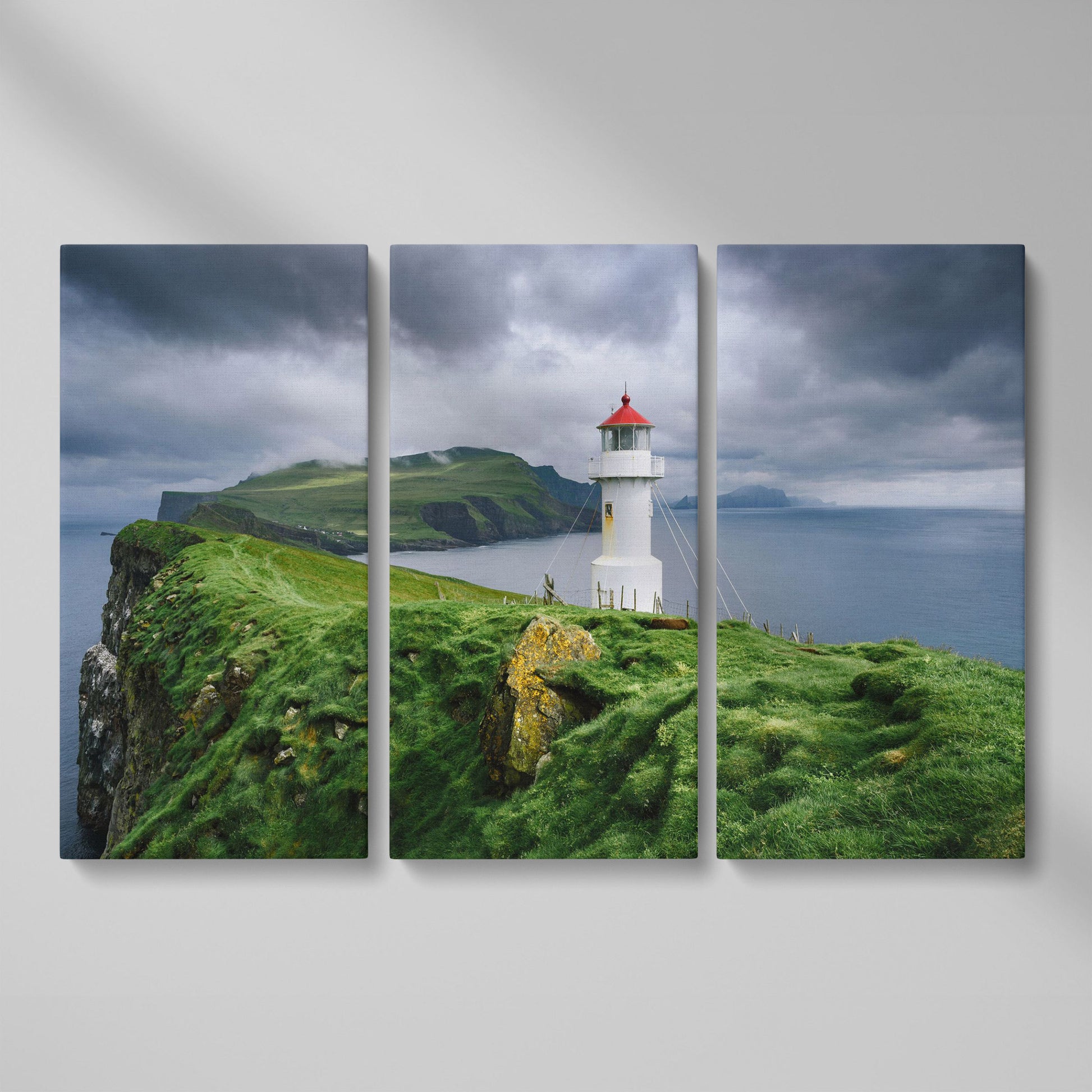 White Lighthouse on a Stormy Cliff, Coastal Canvas Wall Art as 3-panel split version