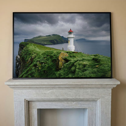 White Lighthouse on a Stormy Cliff, Coastal Canvas Wall Art in black floating frame