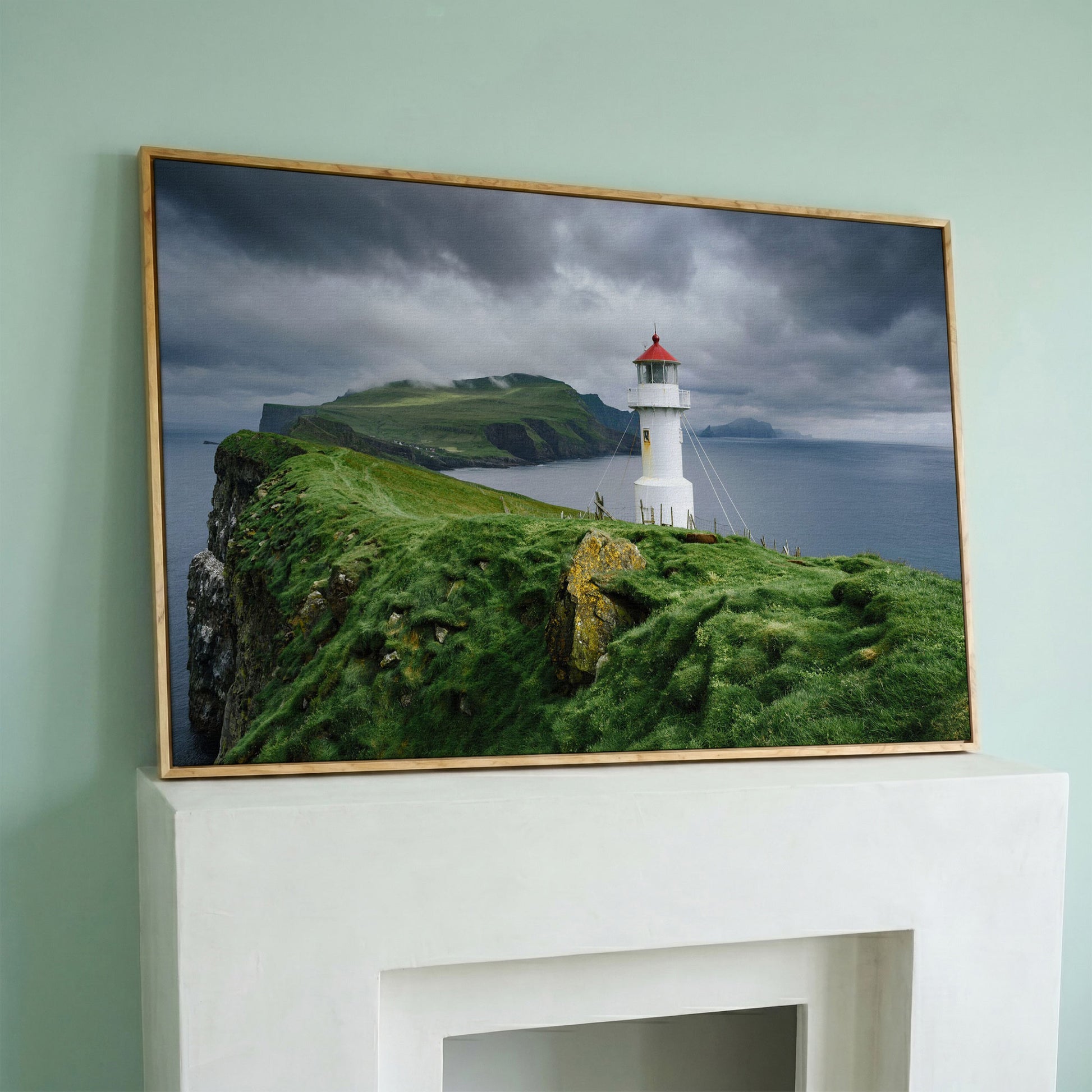 White Lighthouse on a Stormy Cliff, Coastal Canvas Wall Art in white oak floating frame