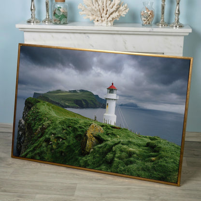 White Lighthouse on a Stormy Cliff, Coastal Canvas Wall Art in rose gold floating frame