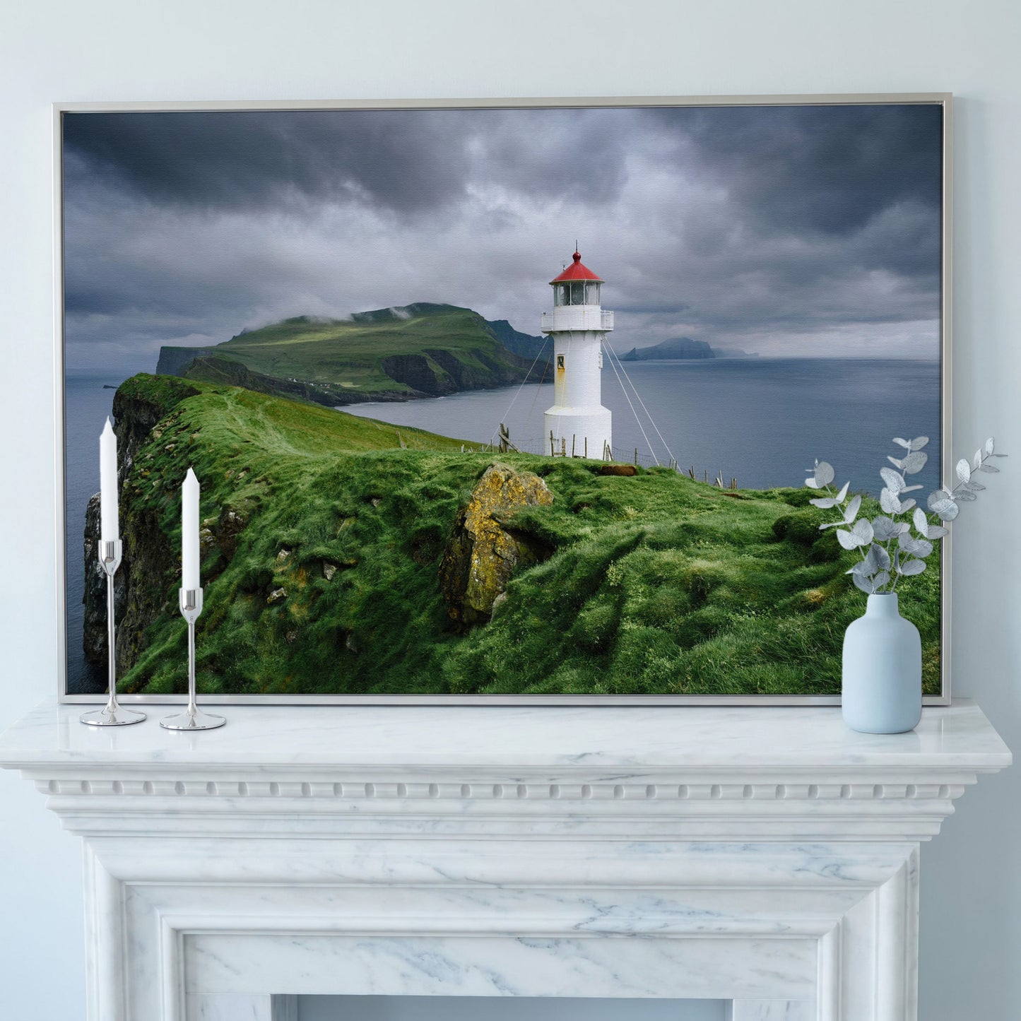 White Lighthouse on a Stormy Cliff, Coastal Canvas Wall Art in silver floating frame