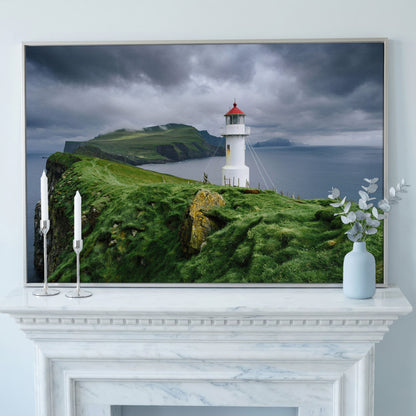 White Lighthouse on a Stormy Cliff, Coastal Canvas Wall Art in silver floating frame