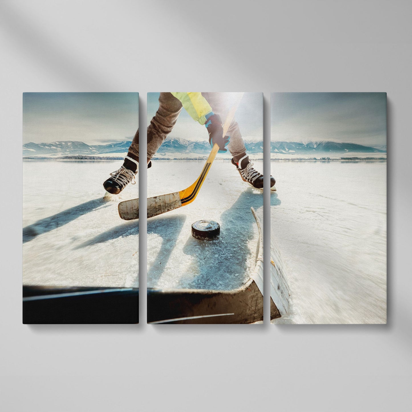 Outdoor Ice Hockey Action Canvas Wall Art with Mountain View as 3-panel split version