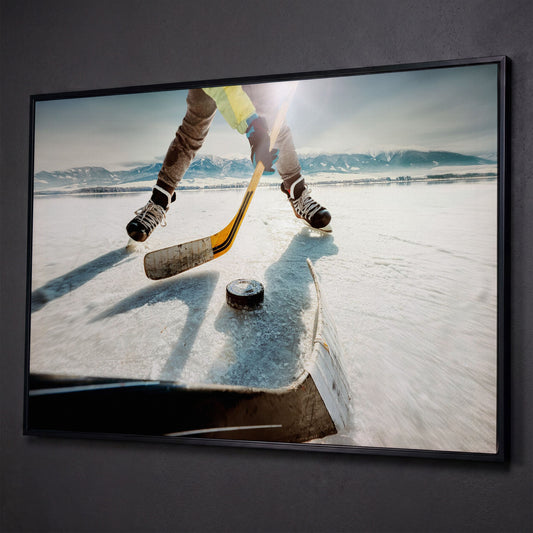 Outdoor Ice Hockey Action Canvas Wall Art with Mountain View shown in black floating frame