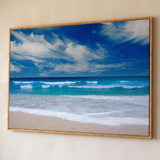 Moody Ocean Waves Seascape Canvas Art, Beach and Sky shown in white oak floating frame