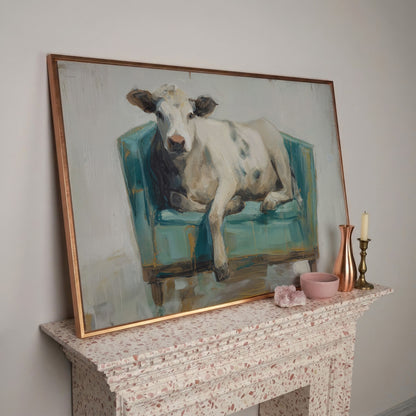 Holy Cow in an Armchair: Whimsical Animal Canvas Wall Art in rose gold floating frame