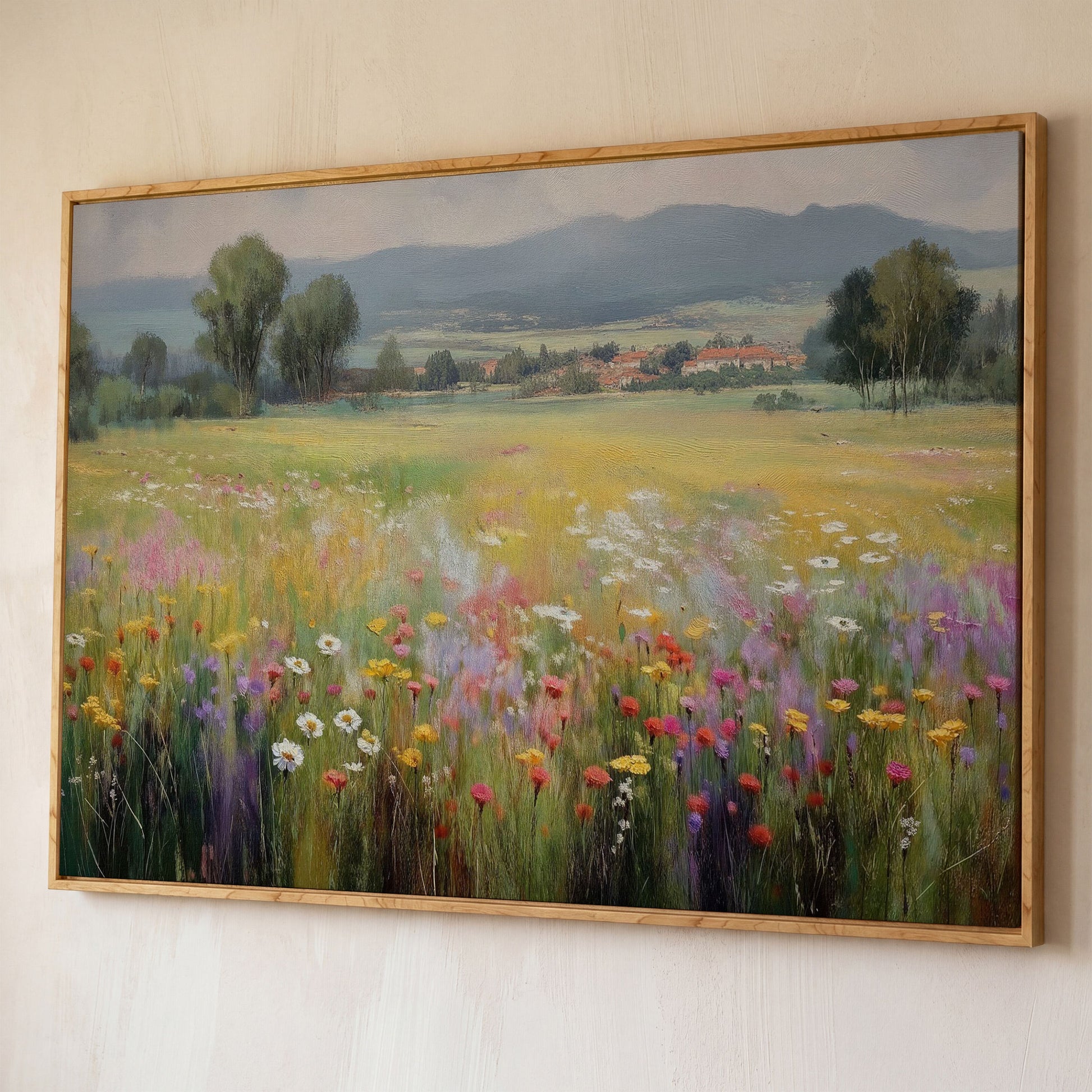 Wildflower Meadow and Rolling Hills Landscape Canvas Art shown in white oak floating frame