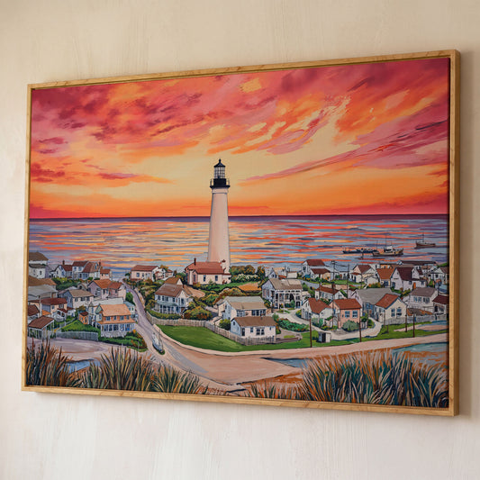 Lighthouse at Sunset, Coastal Village Canvas Wall Art shown in white oak floating frame