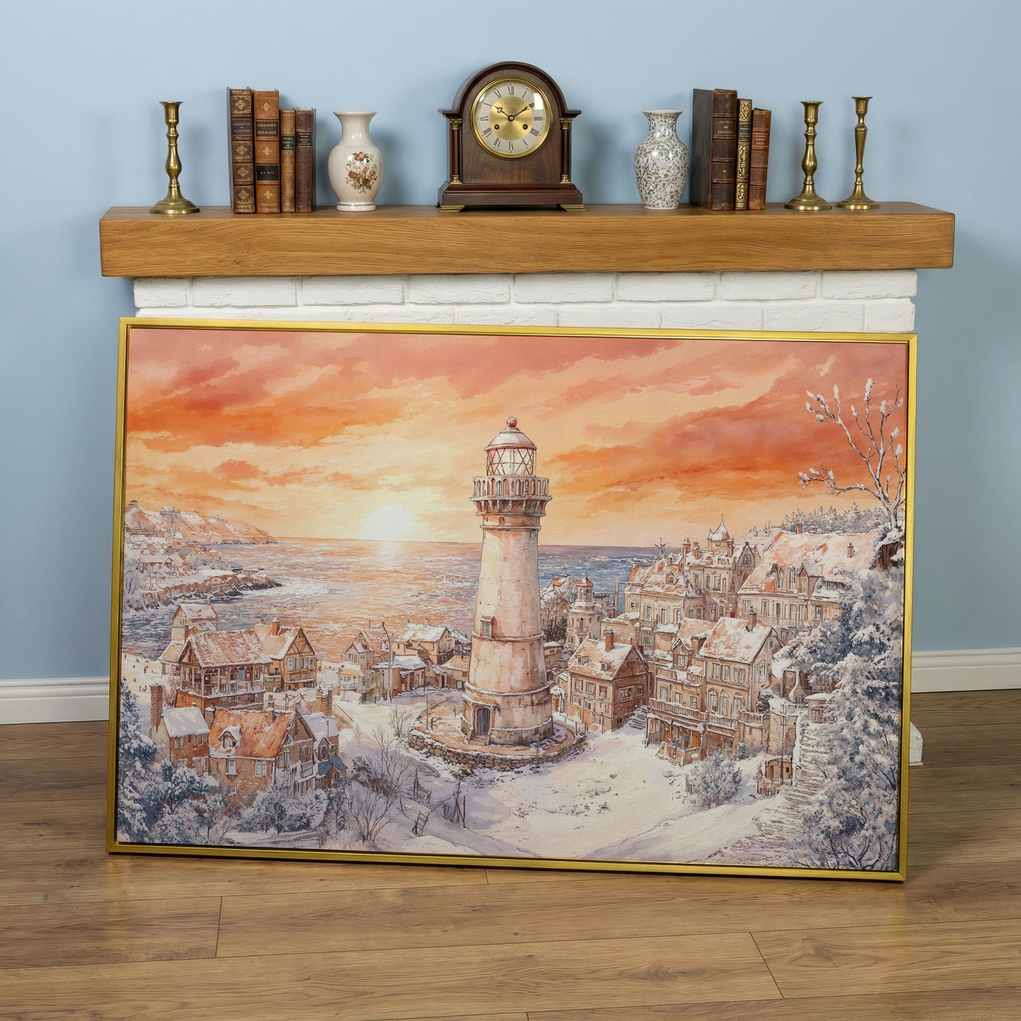 Snowy Coastal Village with Lighthouse at Sunrise Canvas Art in yellow gold floating frame