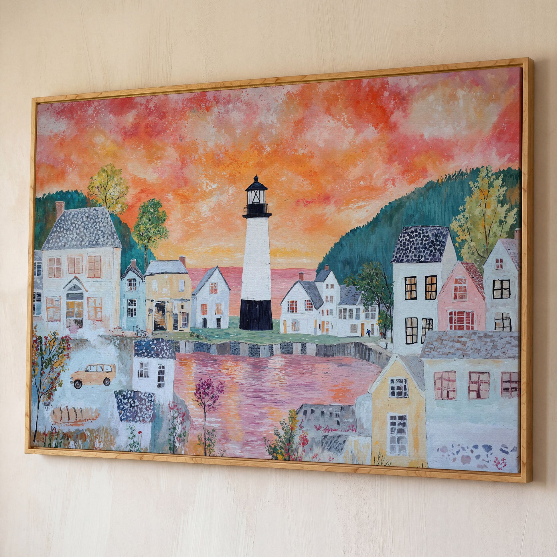 Lighthouse Village at Sunset Canvas Wall Art shown in white oak floating frame