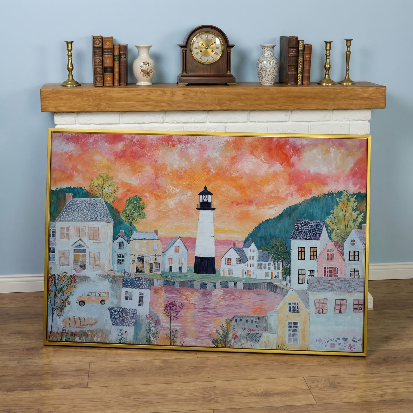 Lighthouse Village at Sunset Canvas Wall Art in yellow gold floating frame