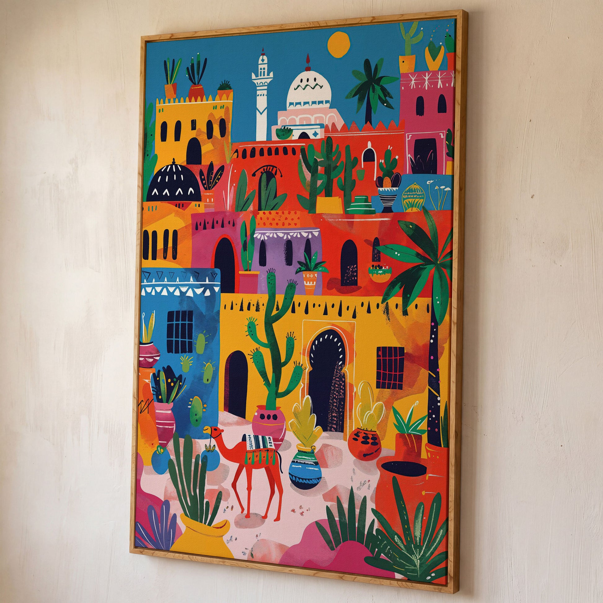Moroccan Town Canvas Art with Camel, Cacti and Palm Trees shown in white oak floating frame