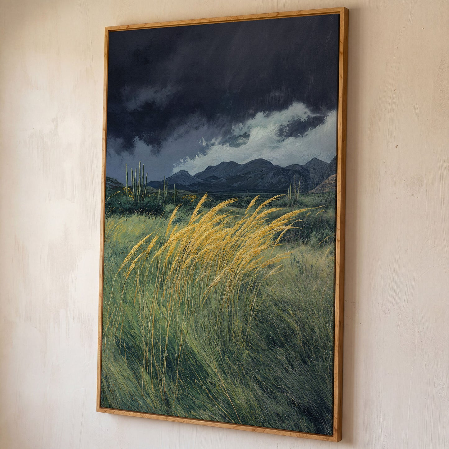 Stormy Prairie Canvas with Cacti and Golden Grass shown in white oak floating frame