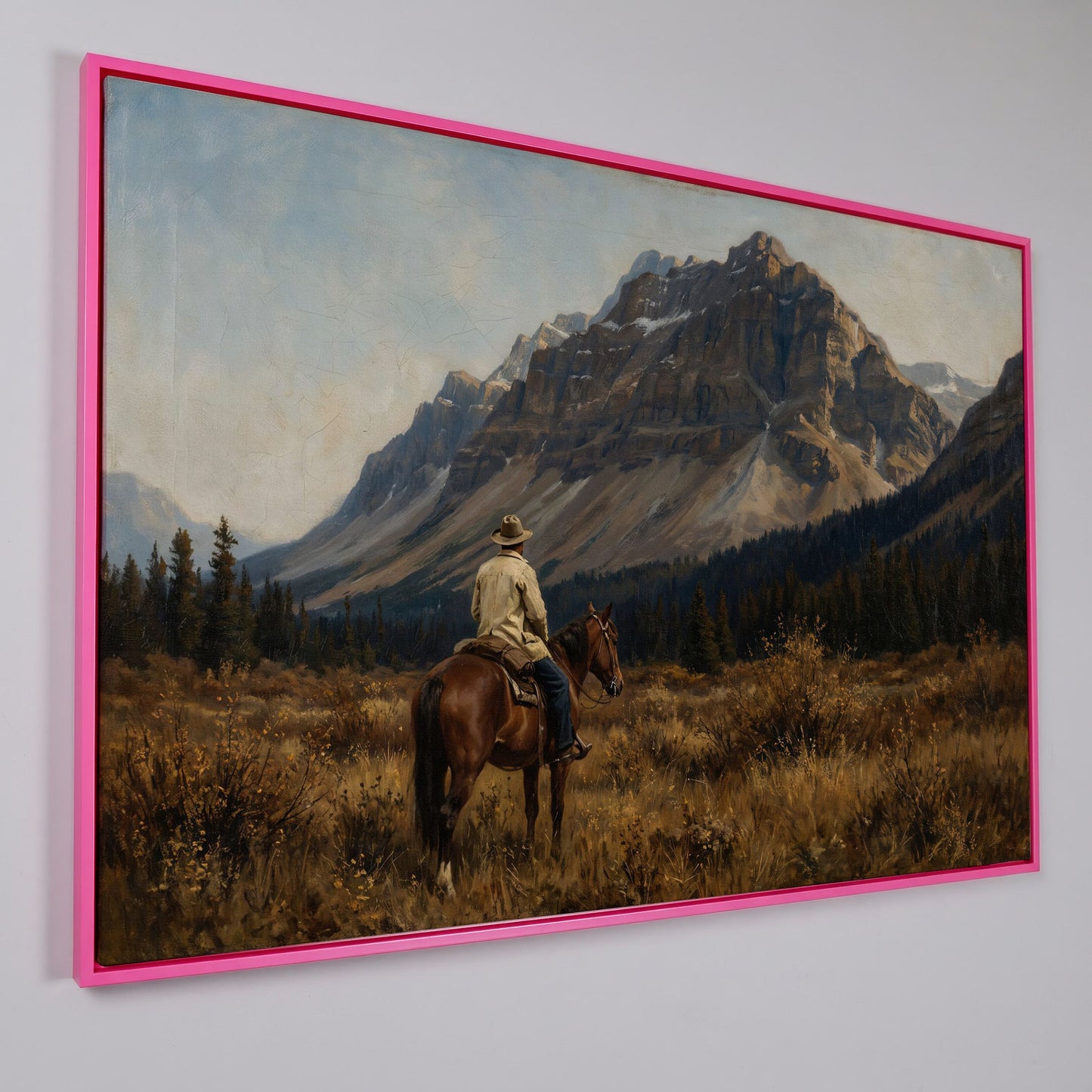 Cowboy on Horseback Facing the Mountains Canvas Wall Art in pink floating frame