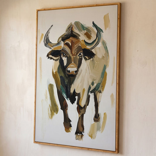 Bold Bull Portrait Canvas Art in Expressive Brushstrokes shown in white oak floating frame