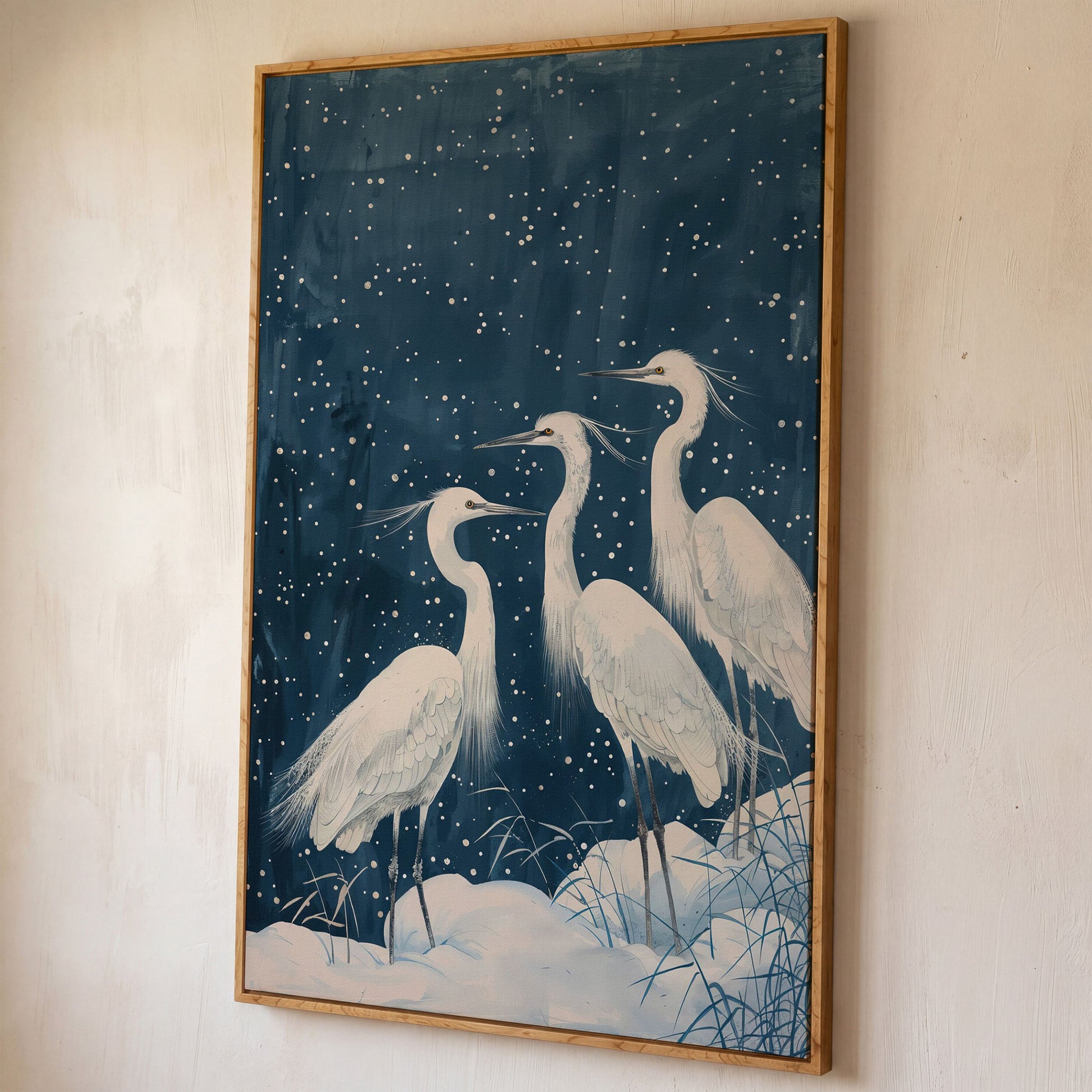Three White Egrets in a Winter Night Sky Canvas Print shown in white oak floating frame