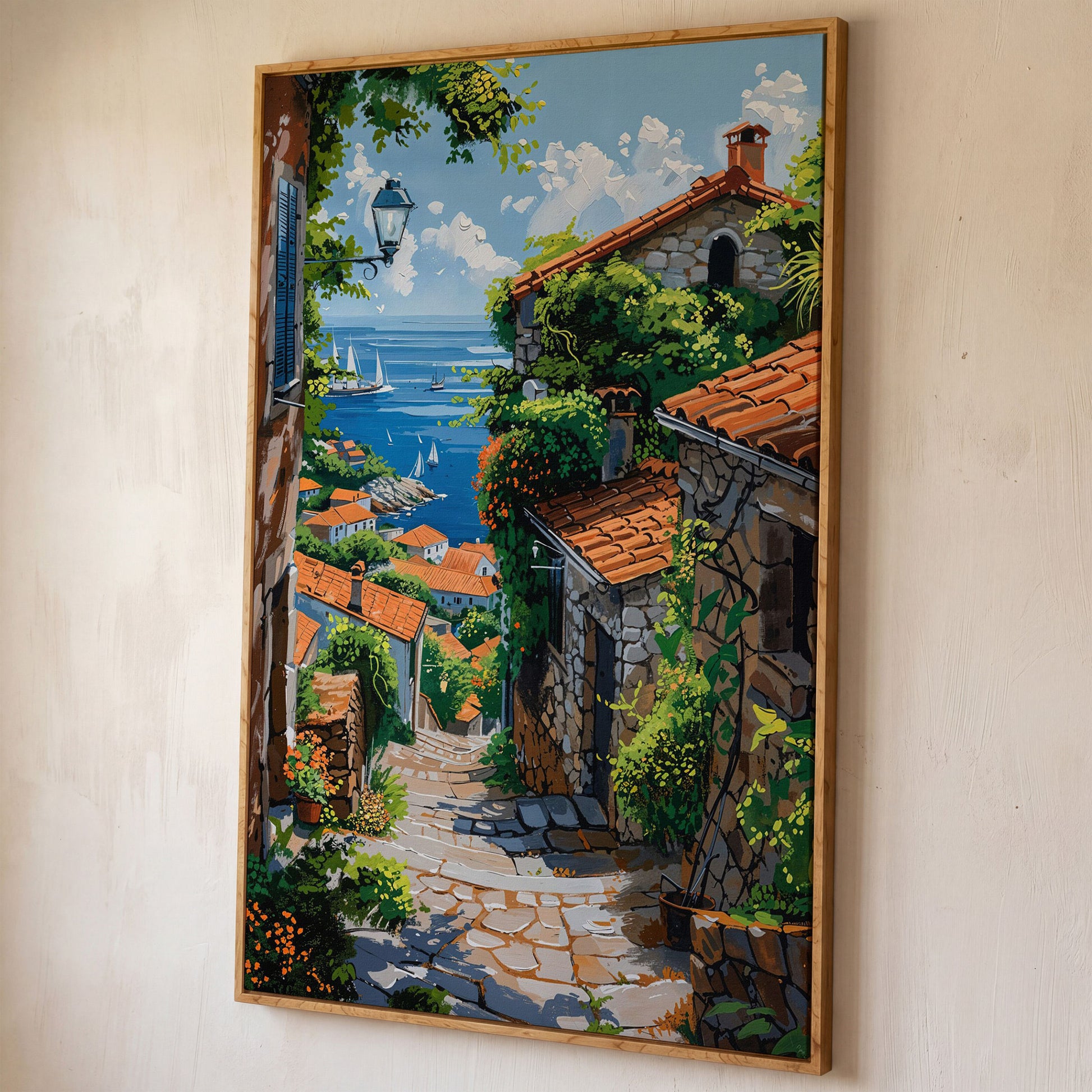 Coastal Village Canvas Art, Sailboats and Stone Streets shown in white oak floating frame